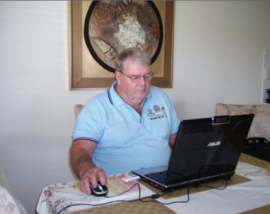 John Weir (veteran) at his laptop